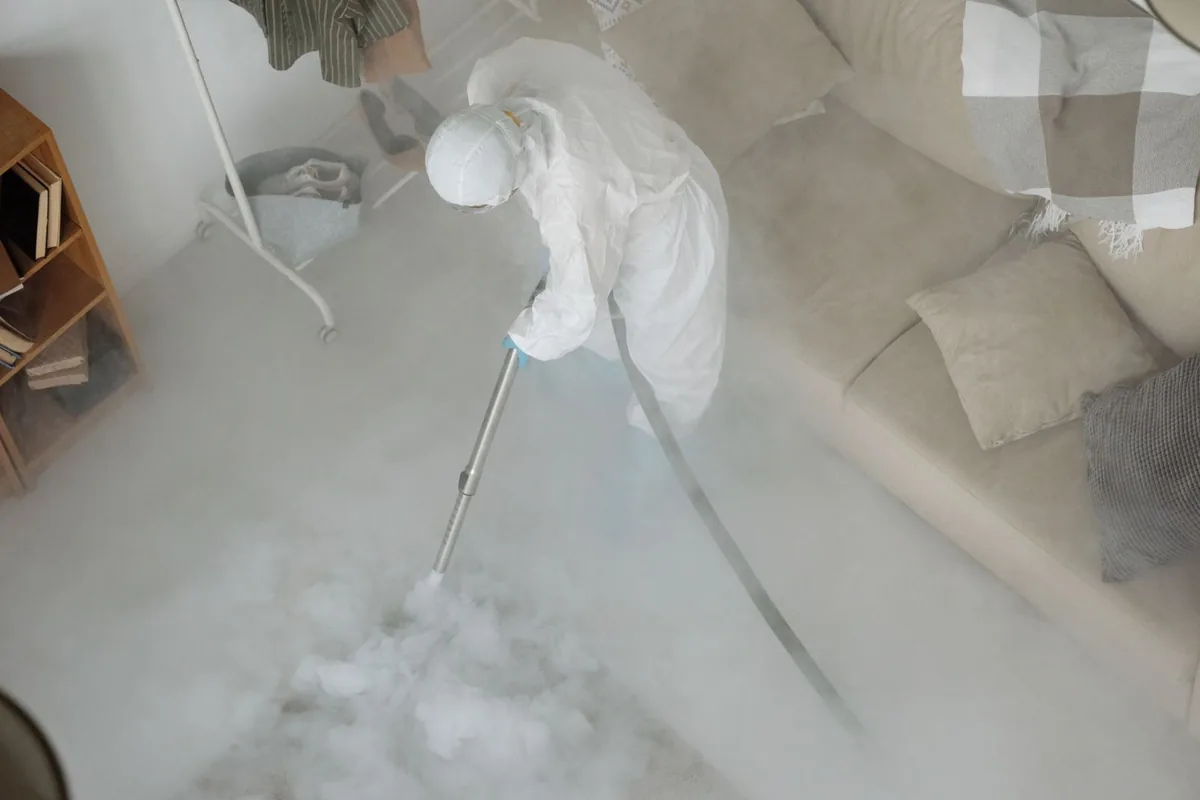 Biohazard cleanup technician in protective equipment, Choctaw Lake, OH